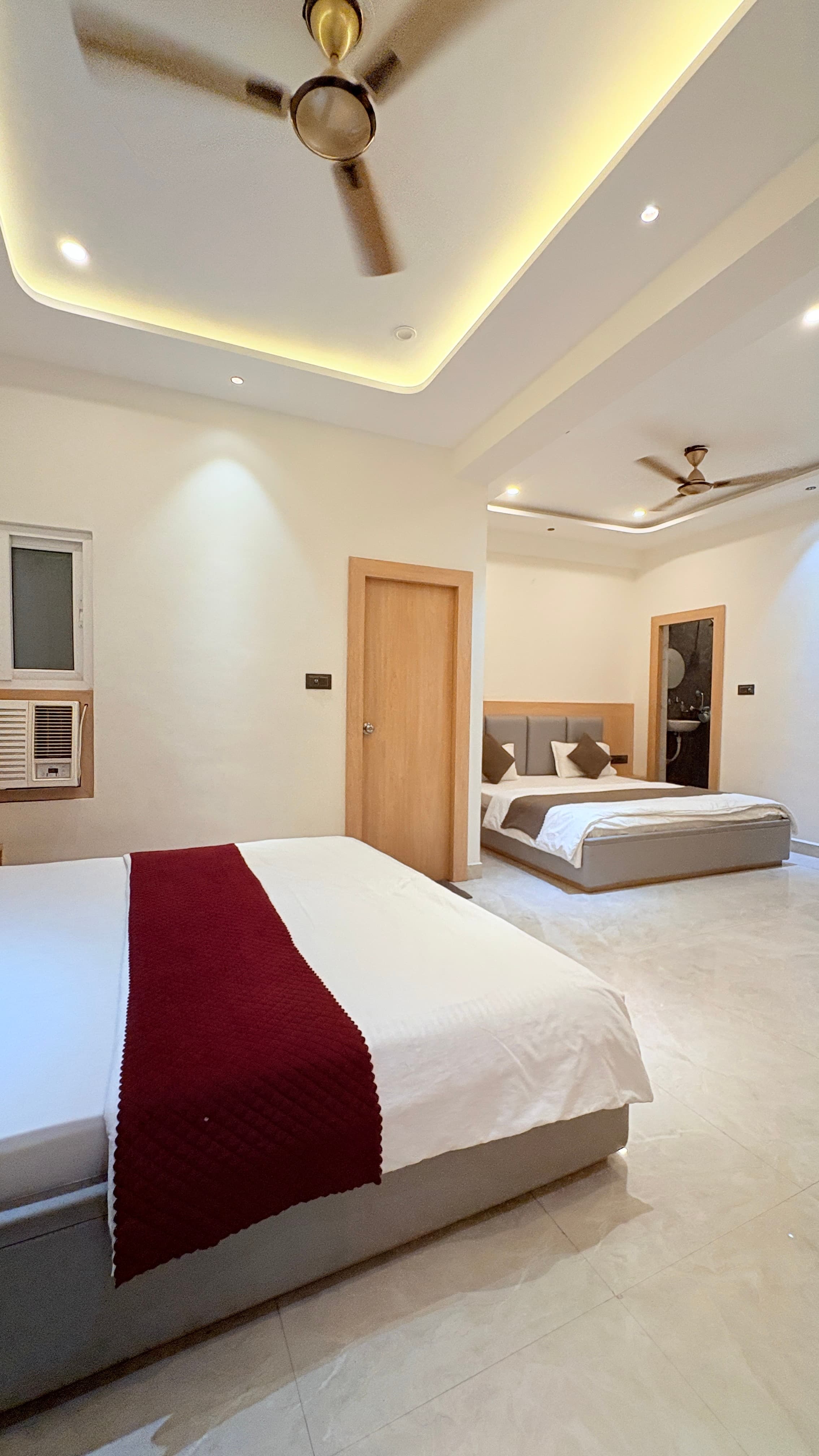 Family room with four beds and a writing desk